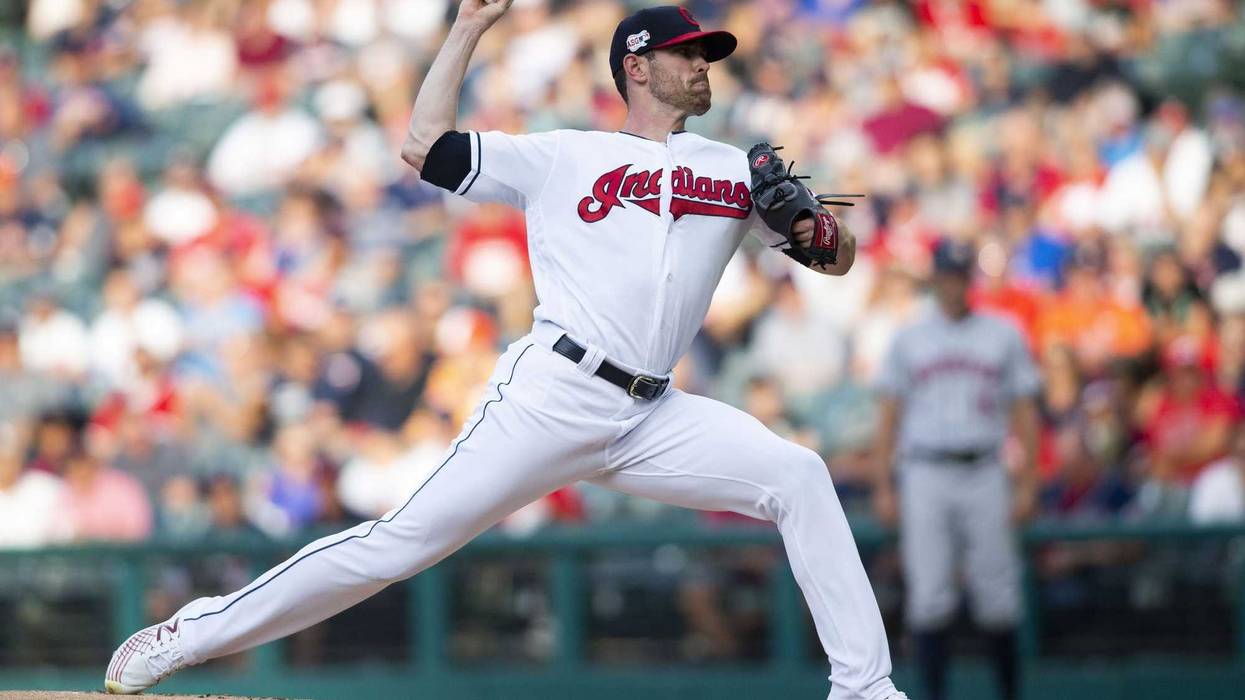 Jul 30, 2019; Cleveland, OH, USA; Cleveland Indians starting pitcher Shane Bieber (57) pitches to Houston Astros center fielder George Springer (4) during the first inning at Progressive Field. Mandatory Credit: Scott R. Galvin-USA TODAY Sports