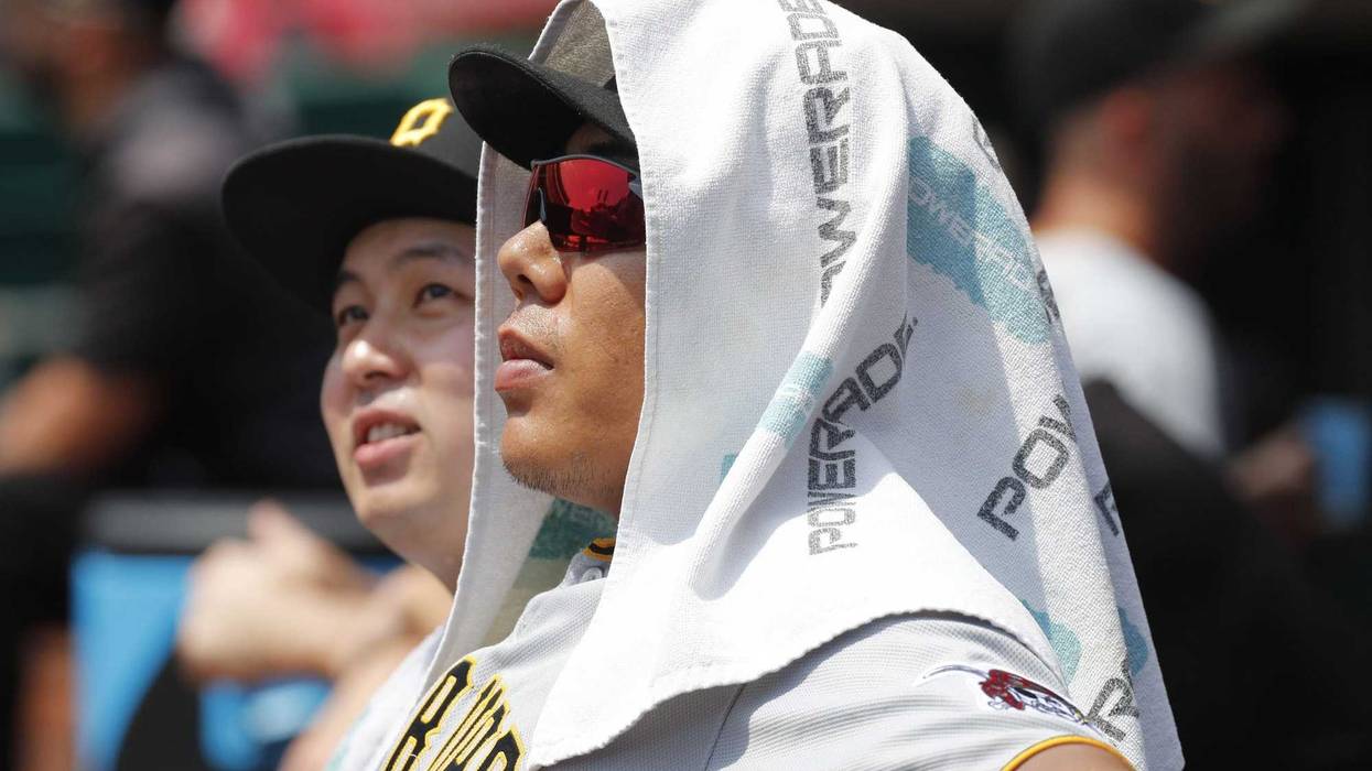 Jul 31, 2019; Cincinnati, OH, USA; Pittsburgh Pirates infielder Jung Ho Kang (16) watches from the dugout against the Cincinnati Reds