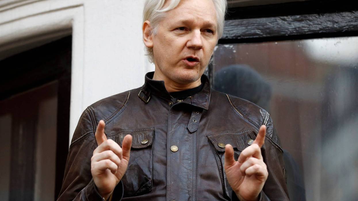 Julian Assange speaks to the media outside the Ecuadorian embassy in London, May 19, 2017. Assange will plead guilty to a felony charge in a deal with the U.S. Justice Department that will free him from prison and resolve a long-running legal saga over the publication of a trove of classified documents.