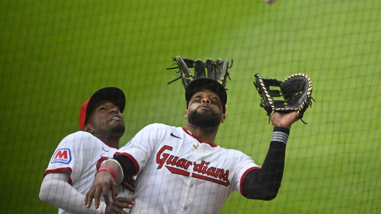 Jun 10, 2025; Cleveland, Ohio, USA; Cleveland Guardians first baseman Carlos Santana (41) catches a foul ball beside second baseman Angel Martinez (1) in the fifth inning against the Cincinnati Reds at Progressive Field.