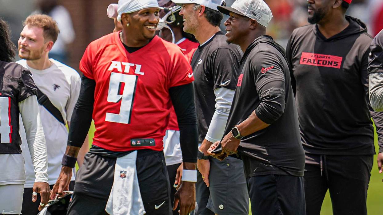 Jun 11, 2025; Atlanta, GA, USA; Atlanta Falcons quarterback Michael Penix Jr. (9) and head coach Raheem Morris on the field during Minicamp at Children's Healthcare of Atlanta Training Ground. Mandatory Credit: Dale Zanine-Imagn Images