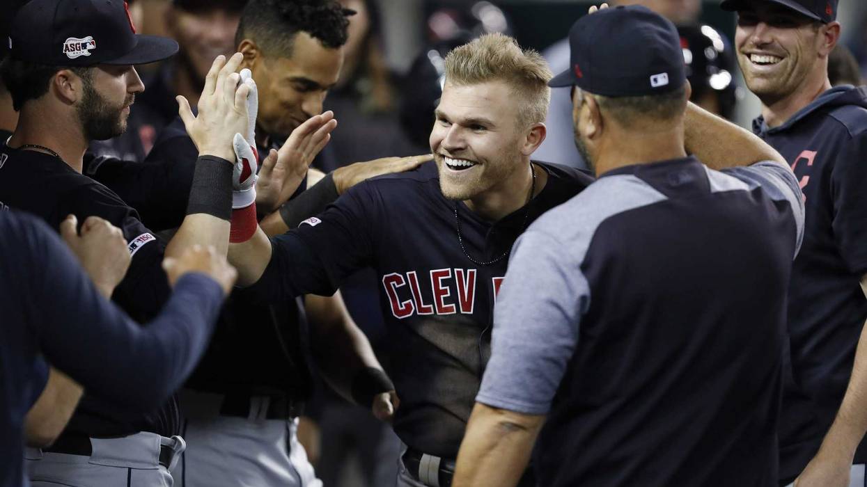Jun 14, 2019; Detroit, MI, USA; Cleveland Indians left fielder Jake Bauers (10) celebrates with teammates in the dugout after hitting a two run home run against the Detroit Tigers during the eighth inning at Comerica Park. Mandatory Credit: Raj Mehta-USA
