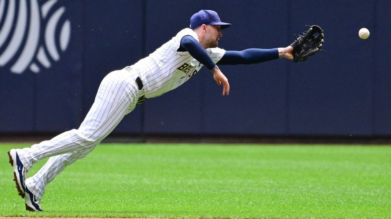 Jun 2, 2024; Milwaukee, Wisconsin, USA; Milwaukee Brewers second baseman Brice Turang (2) can't catch ball in the first inning at American Family Field. Mandatory Credit: Benny Sieu-Imagn Images
