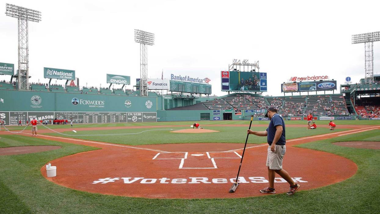 Jun 24, 2018; Boston, MA, USA; Fenway Park grounds crew prep a sign at home play for MLB Allstar voting before the start of the game against the Seattle Mariners.