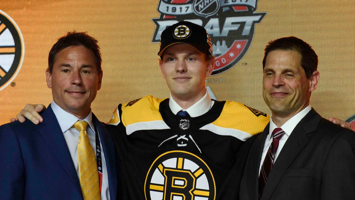June 23, 2017; Chicago, IL, USA; Urho Vaakanainen poses for photos after being selected as the number eighteen overall pick to the Boston Bruins in the first round of the 2017 NHL Draft at the United Center. Mandatory Credit: David Banks-USA TODAY Sports