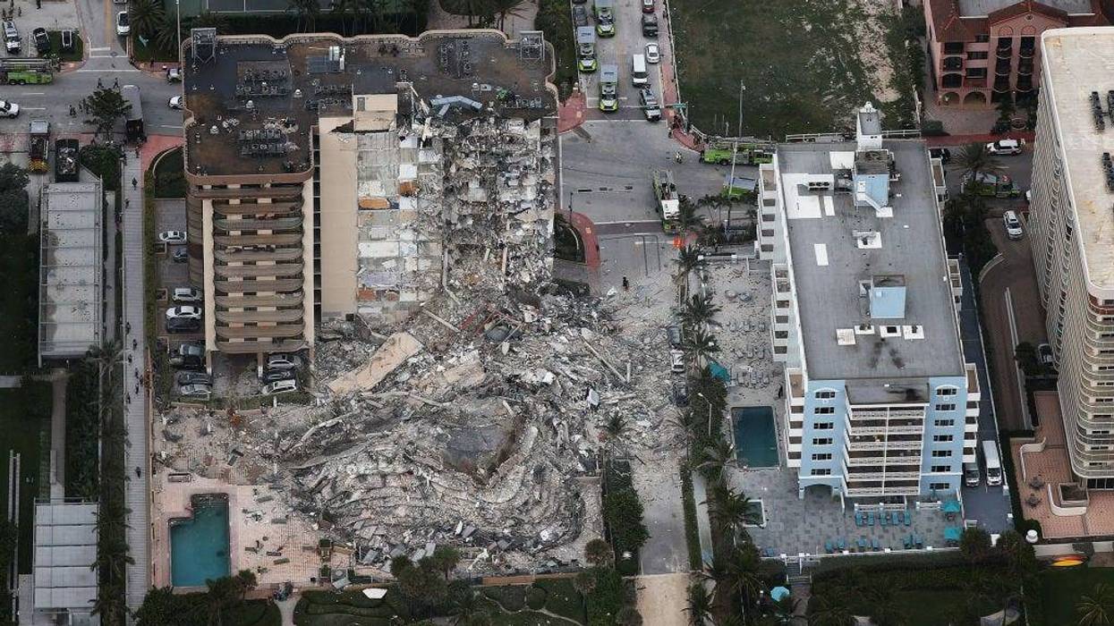 JUNE 24: Search and Rescue personnel work after the partial collapse of the 12-story Champlain Towers South condo building on June 24, 2021 in Surfside, Florida. It is unknown at this time how many people were injured as search-and-rescue effort continues with rescue crews from across Miami-Dade and Broward counties.