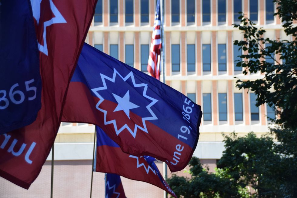 Juneteenth Flags are installed in St. Louis County on Monday