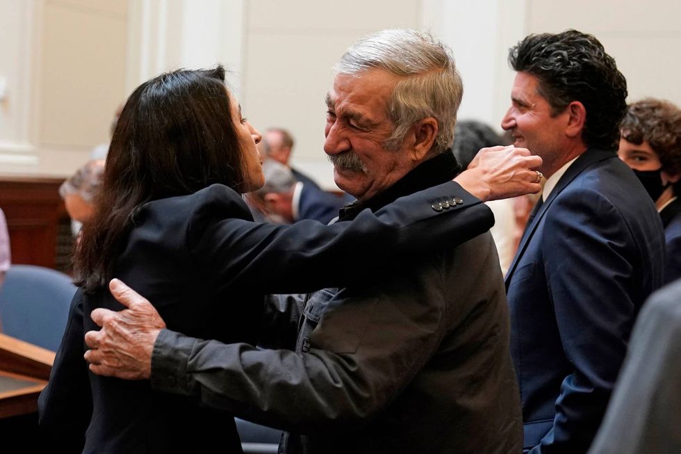 Justice Patricia Guerrero embraces her father, Jorge Guerrero, after being confirmed to the Supreme Court of California Tuesday, March 22, 2022, in San Francisco. Guerrero, the daughter of Mexican immigrants who grew up in the agricultural Imperial Valley will be the first Latina on the state