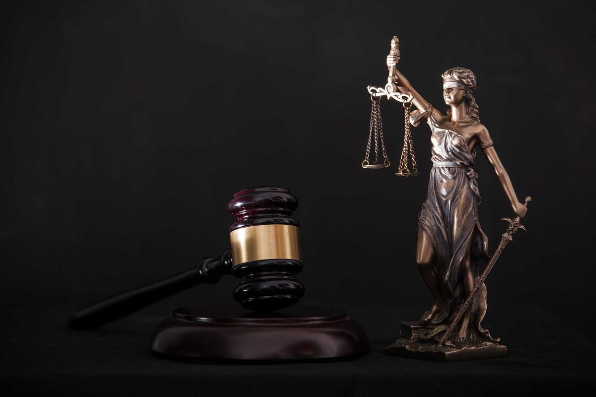 Justice statue and gavel stock photo.
