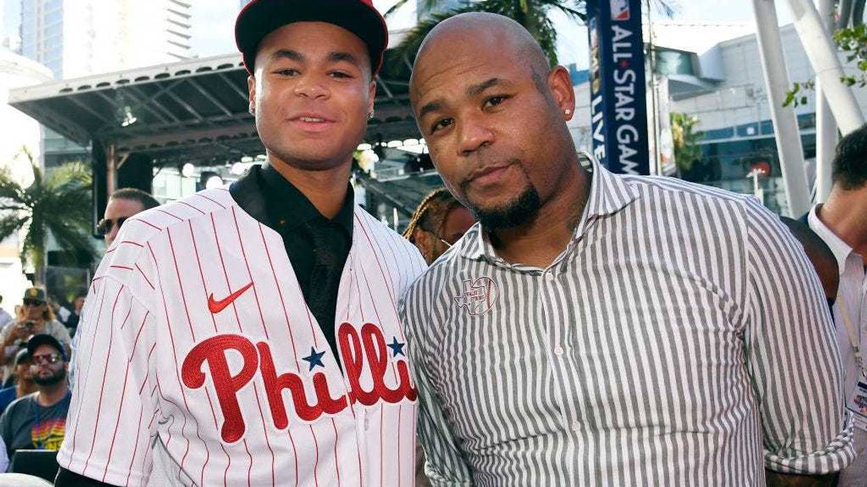 Justin Crawford poses with father Carl Crawford