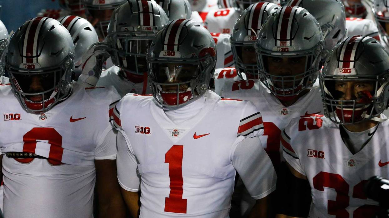 Justin Fields (1) prepares to lead the Buckeyes onto the field