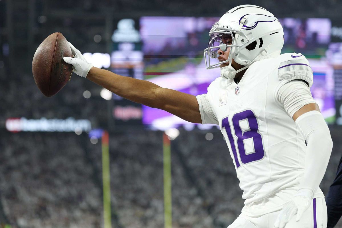 Justin Jefferson #18 of the Minnesota Vikings celebrates a first quarter touchdown against the Chicago Bears at U.S. Bank Stadium on December 16, 2024 in Minneapolis, Minnesota.