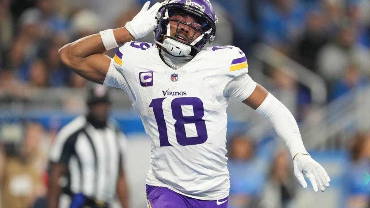 Justin Jefferson #18 of the Minnesota Vikings celebrates after a touchdown and is celebrating a massive new contract on Monday.