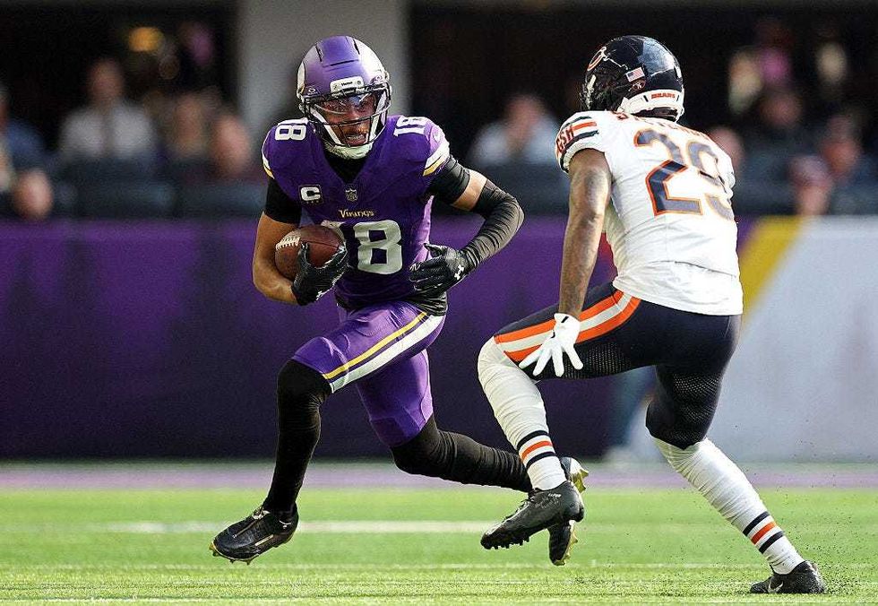 Justin Jefferson #18 of the Minnesota Vikings runs with the ball against Tyrique Stevenson #29 of the Chicago Bears during the first quarter at U.S. Bank Stadium on November 16, 2025 in Minneapolis, Minnesota.