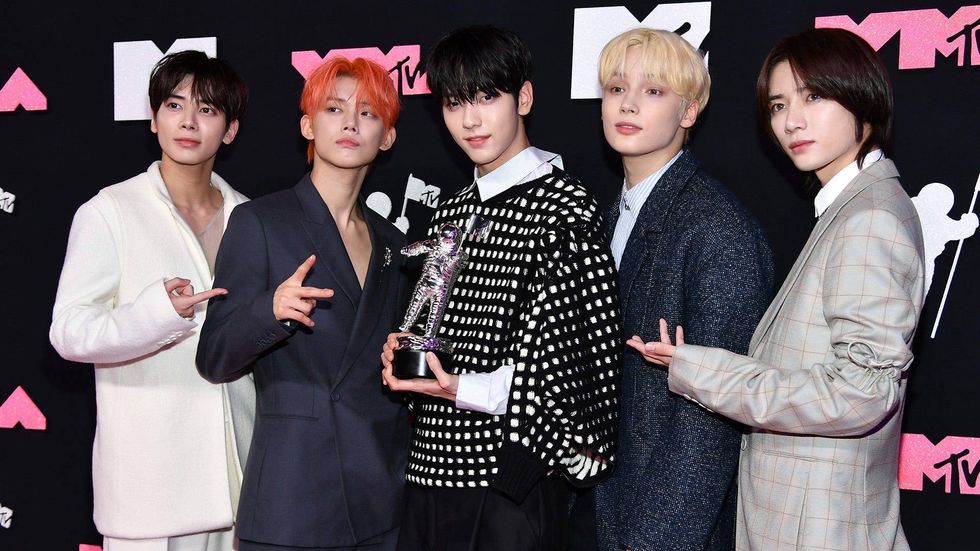 Kang Taehyun, Yeonjun, Soobin, Huening Kai, and Beomgyu of TOMORROW X TOGETHER