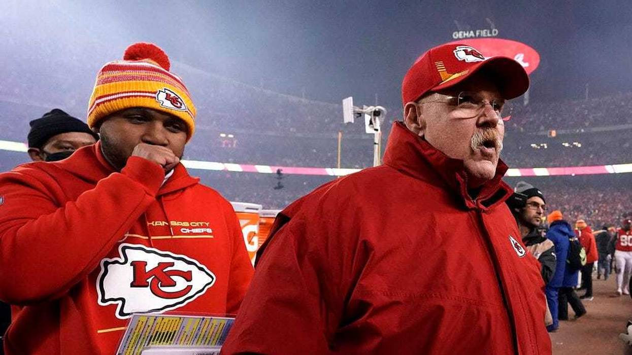 Kansas City Chiefs head coach Andy Reid, right, walks off the field.