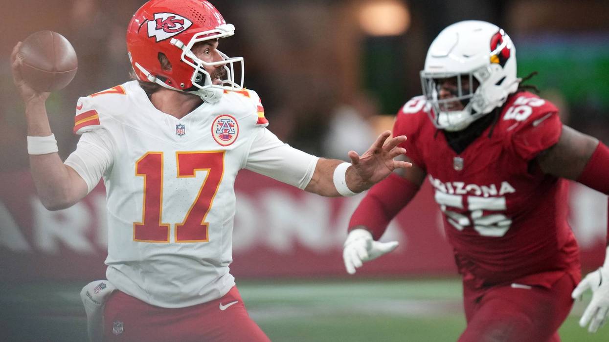 Kansas City Chiefs quarterback Gardner Minshew (17) looks to throw the ball as Arizona Cardinals defensive lineman Dante Stills (55) closes in during their preseason game at State Farm Stadium on Aug. 9, 2025.