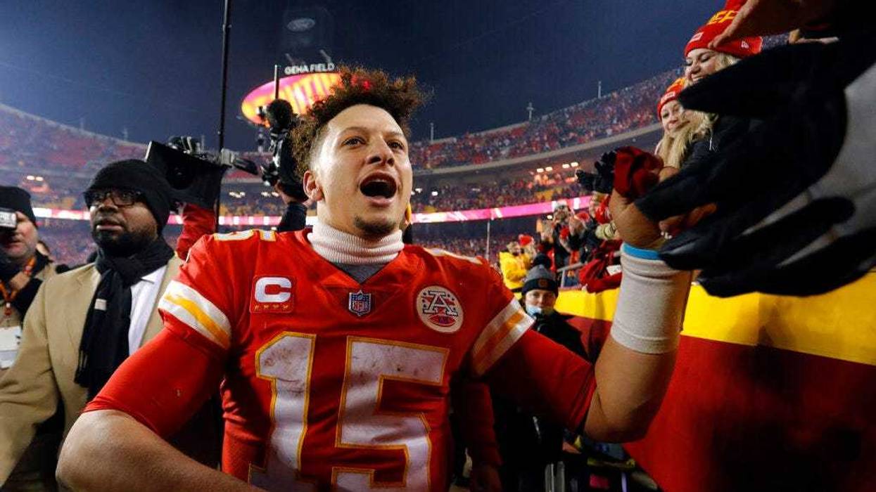 Kansas City Chiefs quarterback Patrick Mahomes (15) celebrates with fans