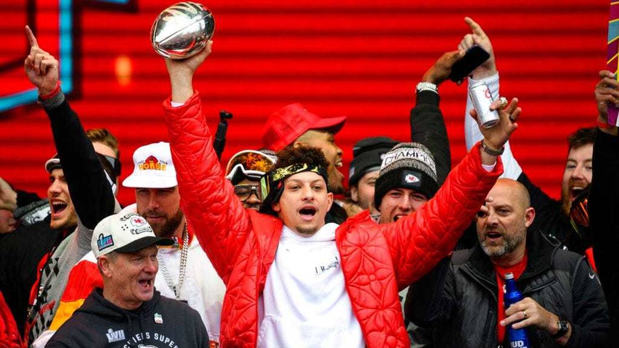 Kansas City Chiefs quarterback Patrick Mahomes and teammates react to the crowd during the Chiefs' victory celebration and parade in Kansas City,