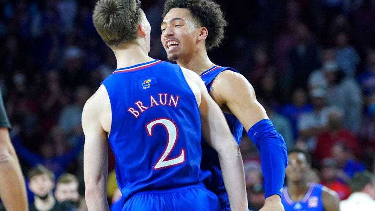 Kansas forward Jalen Wilson, right, celebrates with teammate Christian Braun (2)