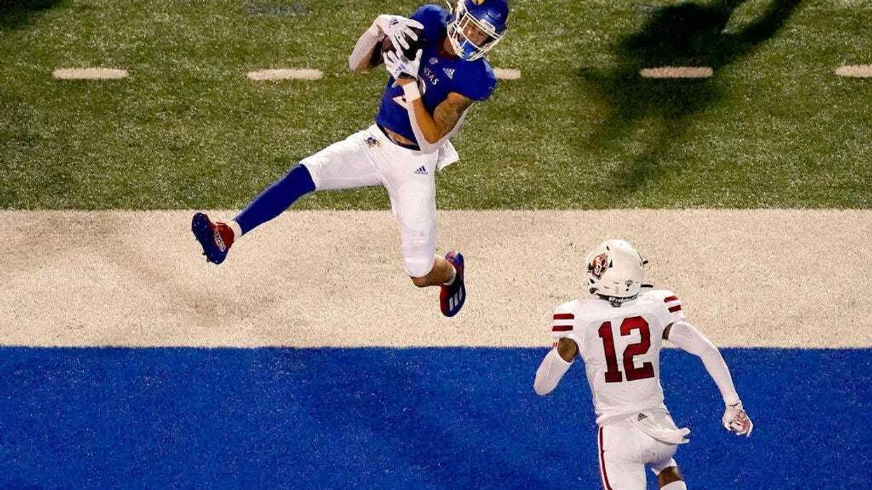Kansas wide receiver Lawrence Arnold (2) catches a pass over South Dakota defensive back Tre Jackson (12) to score a touchdown