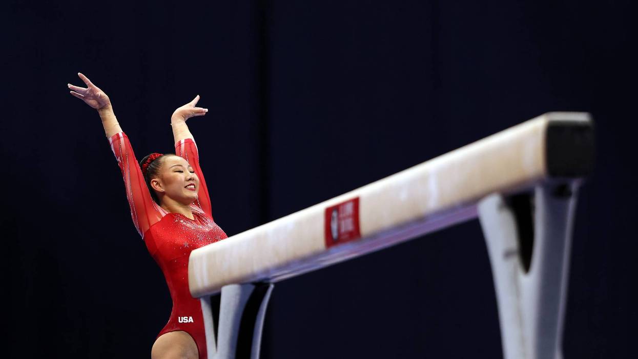 Kara Eaker smiles after landing her dismount off the balance beam during the Women's competition of the 2021 U.S. Gymnastics Olympic