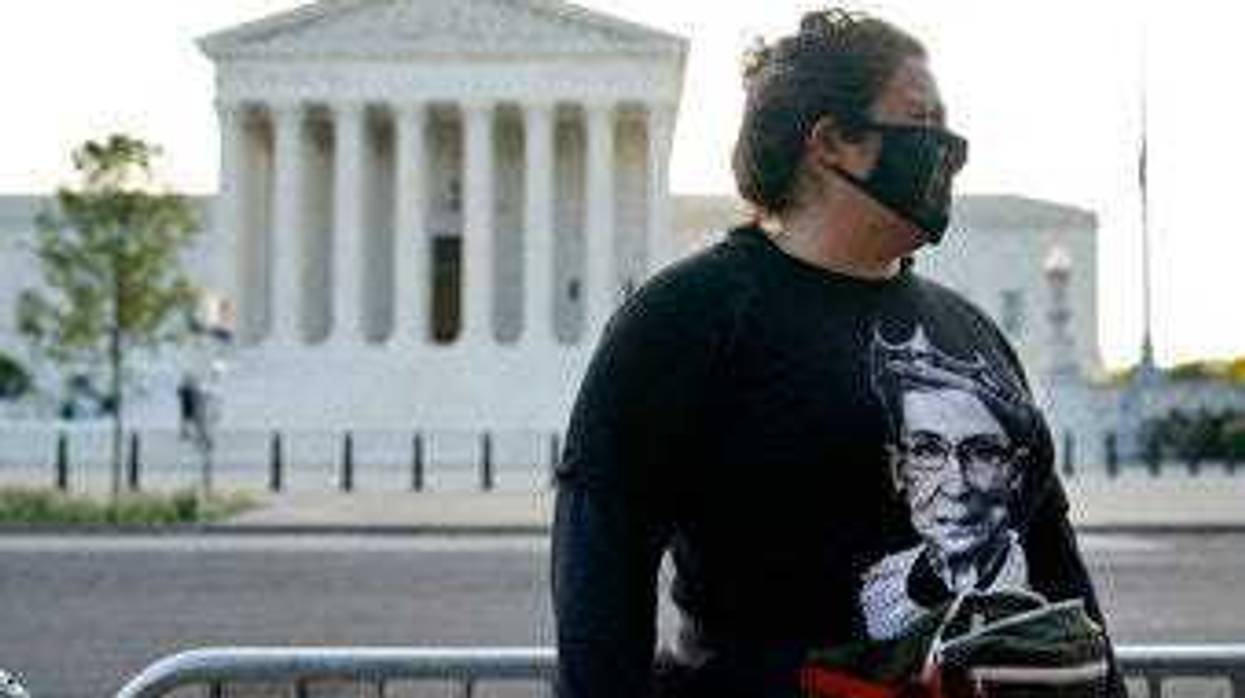Kara Stewart of Martin, Ky., stands outside the Supreme Court in Washington, Wednesday, Sept. 23, 2020, before a private ceremony and public viewing of Justice Ruth Bader Ginsburg. Ginsburg, 87, died of cancer on Sept. 18. (AP Photo/Patrick Semansky)