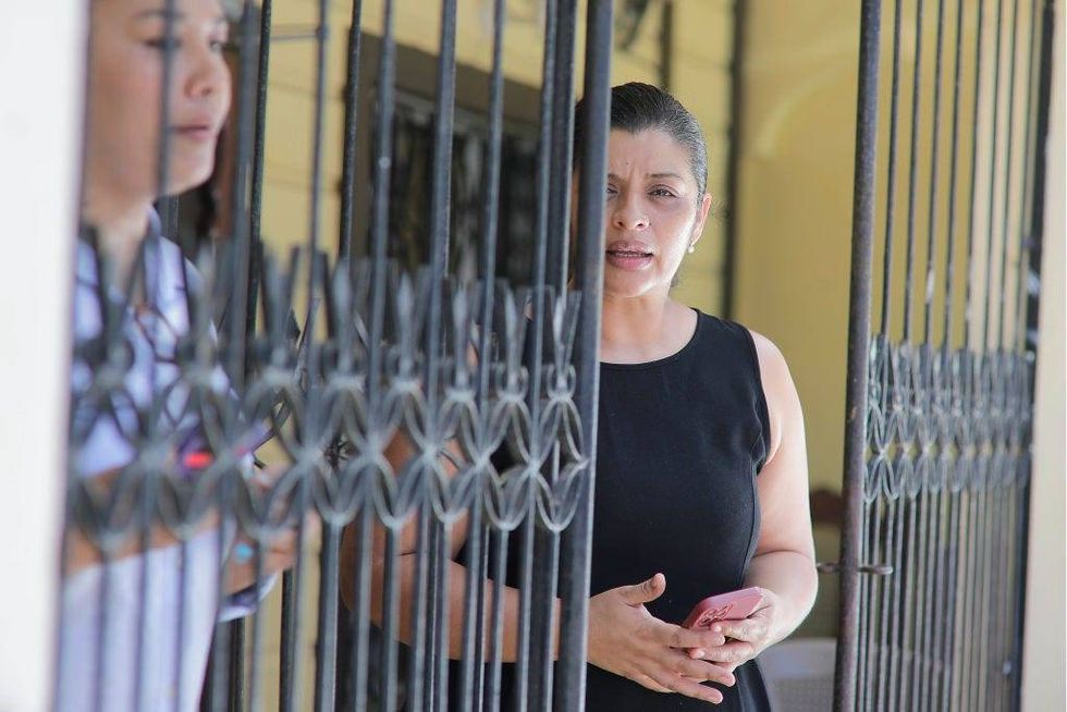Karen Italia Caballero, mother of Alejandro and Fernando Caballero, looks on before speaking to the media outside their home on June 29, 2022, in Honduras. Her sons were found dead inside an overheated 18-wheeler tractor-trailer along with other dozens of other migrants in San Antonio, Texas, on Monday.