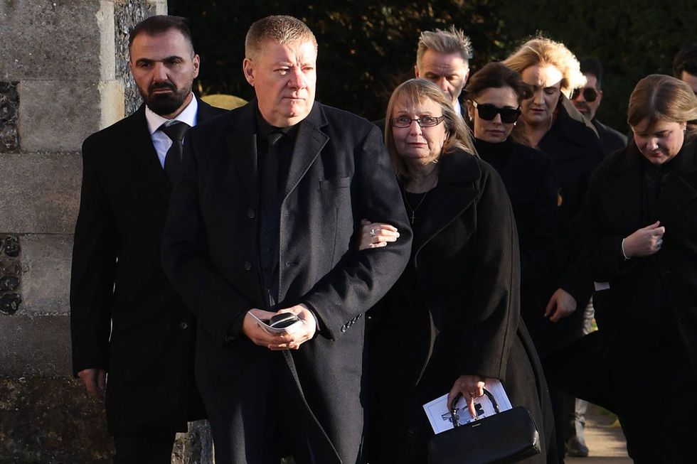 Karen Payne and Geoff Payne, parents of Liam,and Cheryl Tweedy leave following the funeral of singer Liam Payne