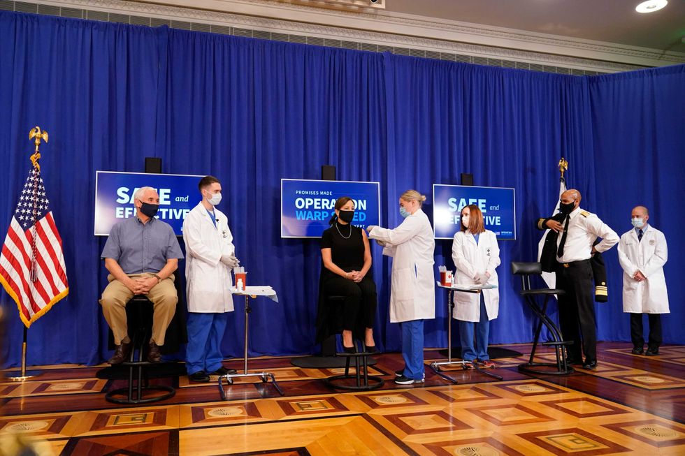 Karen Pence, seated center, receives a Pfizer-BioNTech COVID-19 vaccine shot at the Eisenhower Executive Office Building on the White House complex, Friday, Dec. 18, 2020, in Washington.