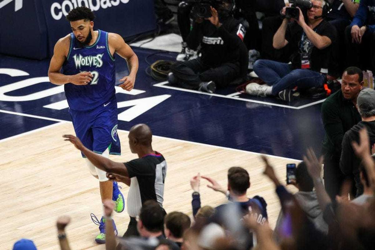Karl-Anthony Towns #32 of the Minnesota Timberwolves looks on after making a basket against the Memphis Grizzlies in the fourth quarter of the game during Game Six of the Western Conference First Round at Target Center on April 29, 2022 in Minneapolis, Minnesota.