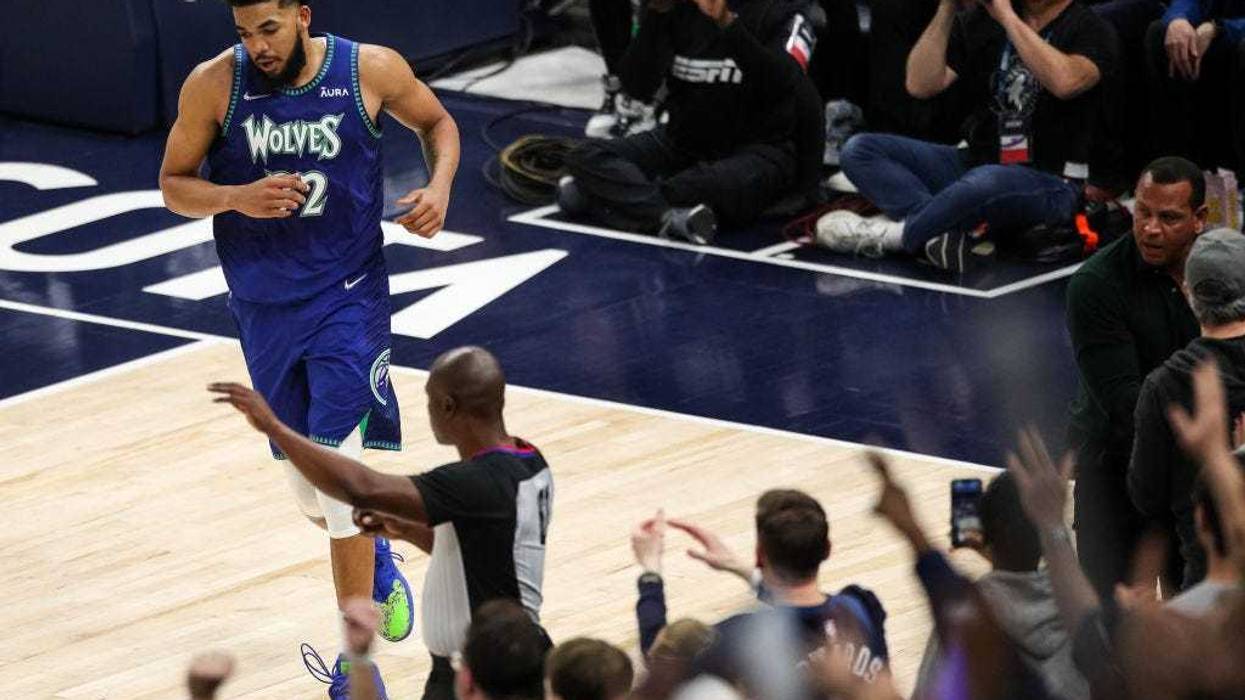 Karl-Anthony Towns #32 of the Minnesota Timberwolves looks on after making a basket against the Memphis Grizzlies in the fourth quarter of the game during Game Six of the Western Conference First Round at Target Center on April 29, 2022 in Minneapolis, Minnesota.