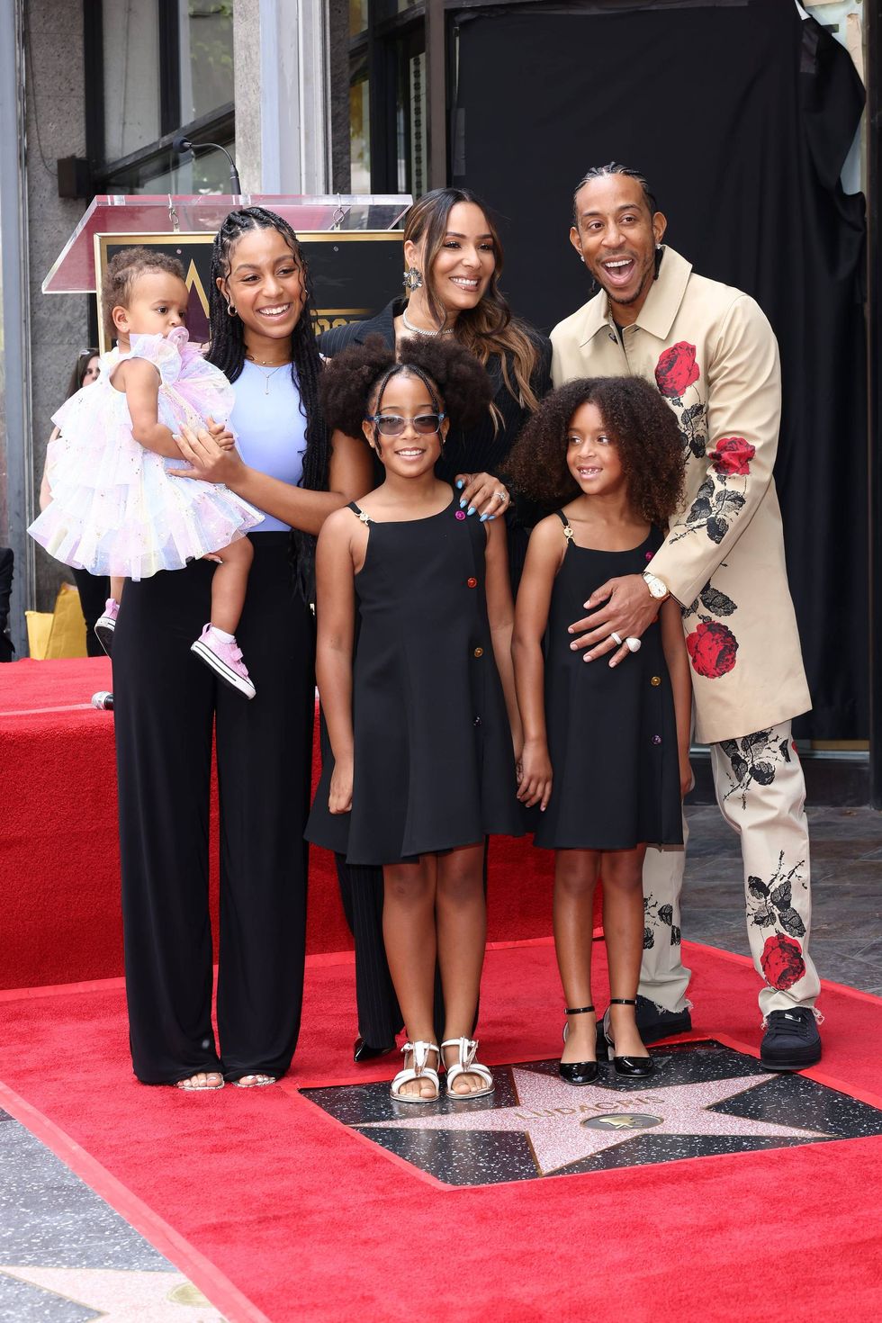 Karma Bridges, Eudoxie Mbouguiengue, Ludacris and family attend a ceremony honoring Ludacris