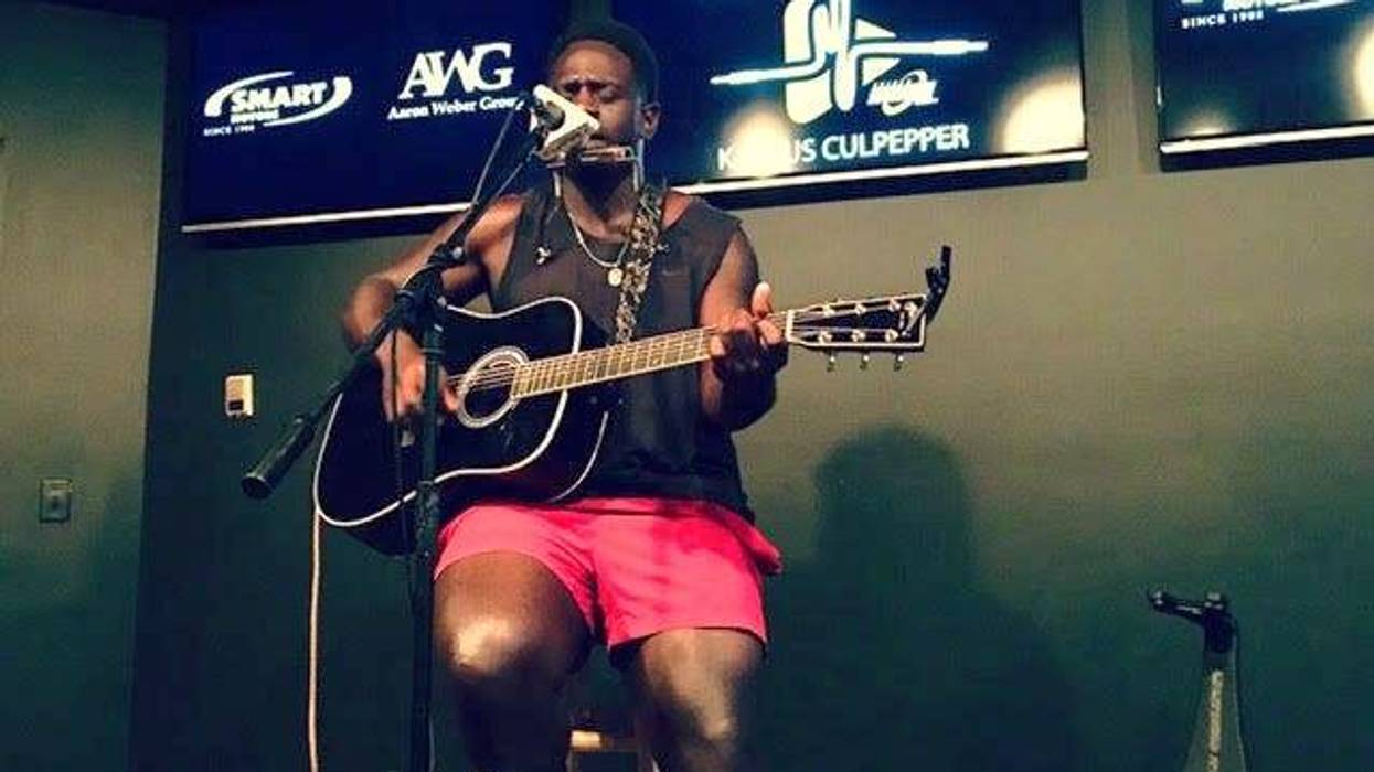 Kashus Culpepper with acoustic guitar