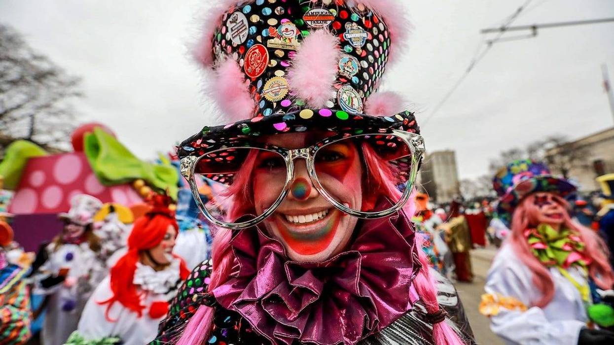 Katie Marinelli, 43, of Royal Oak dresses up as a clown as a member of the Distinguished Clown Corp, during America's Thanksgiving Parade in Detroit on Thursday, Nov. 22, 2018.