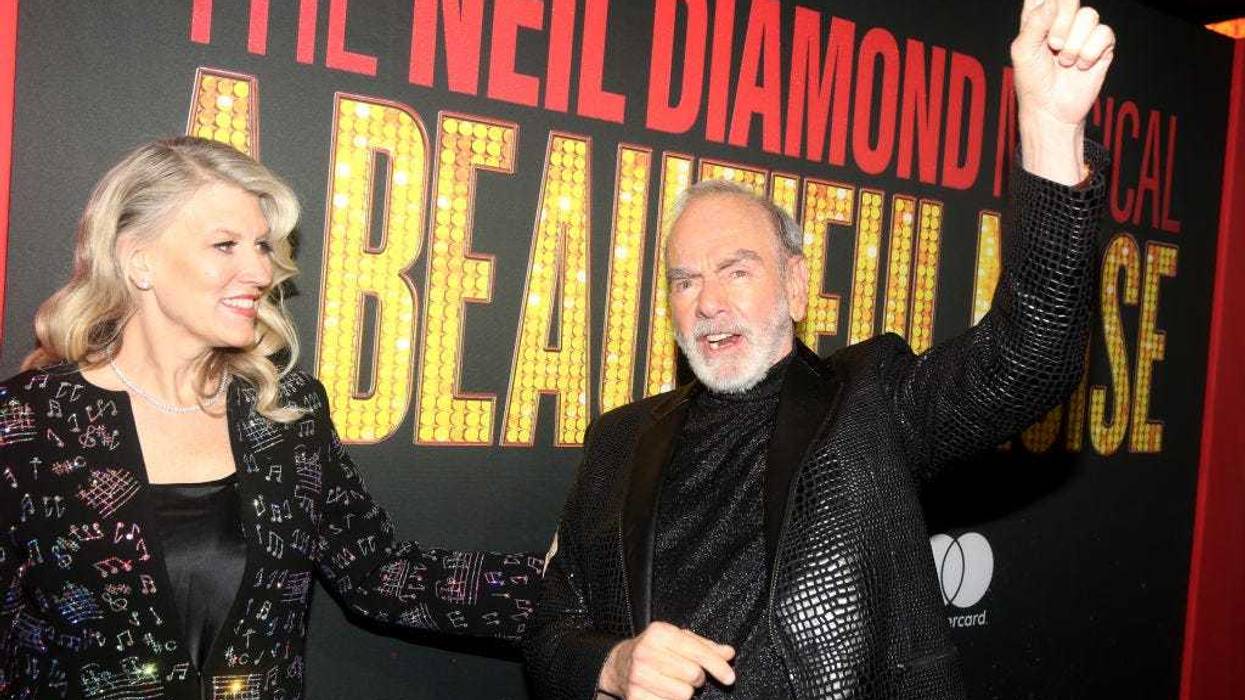 Katie McNeil and Neil Diamond pose at the opening night of the new Neil Diamond musical "A Beautiful Noise" on Broadway at The Broadhurst Theater on December 4, 2022
