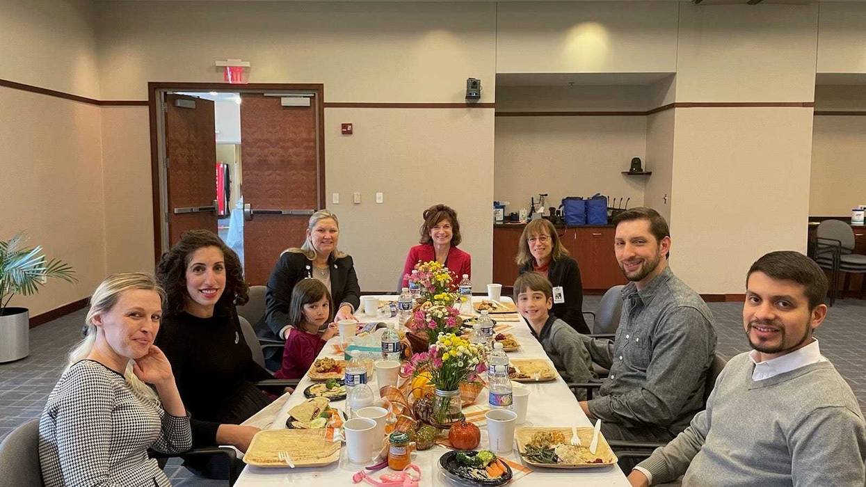 Katie Strickland (far left) and Anna Fischman (right of Strickland) reunited at the Gift of Life Donor Program's Thanksgiving dinner in Philadelphia.