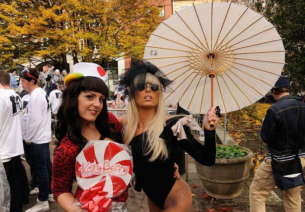 Katy Perry lookalike Delia Marie Williams and Lady Gaga lookalike Victoria Cluskey pose before the MTV Giant Tomato Fight in Golden Square on November 2, 2010 in London, England.