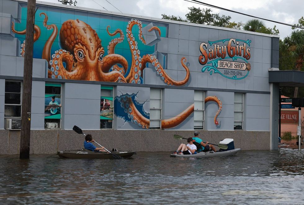 Kayakers paddle along in flood waters after Hurricane Idalia passed offshore on August 30, 2023 in Crystal River