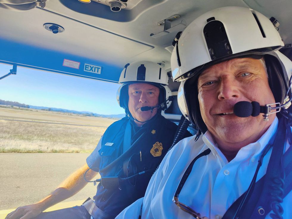 KCBS Radio reporter Jeffrey Schaub with Mark Heine, Fire Chief of the Sonoma County Fire District, in the county