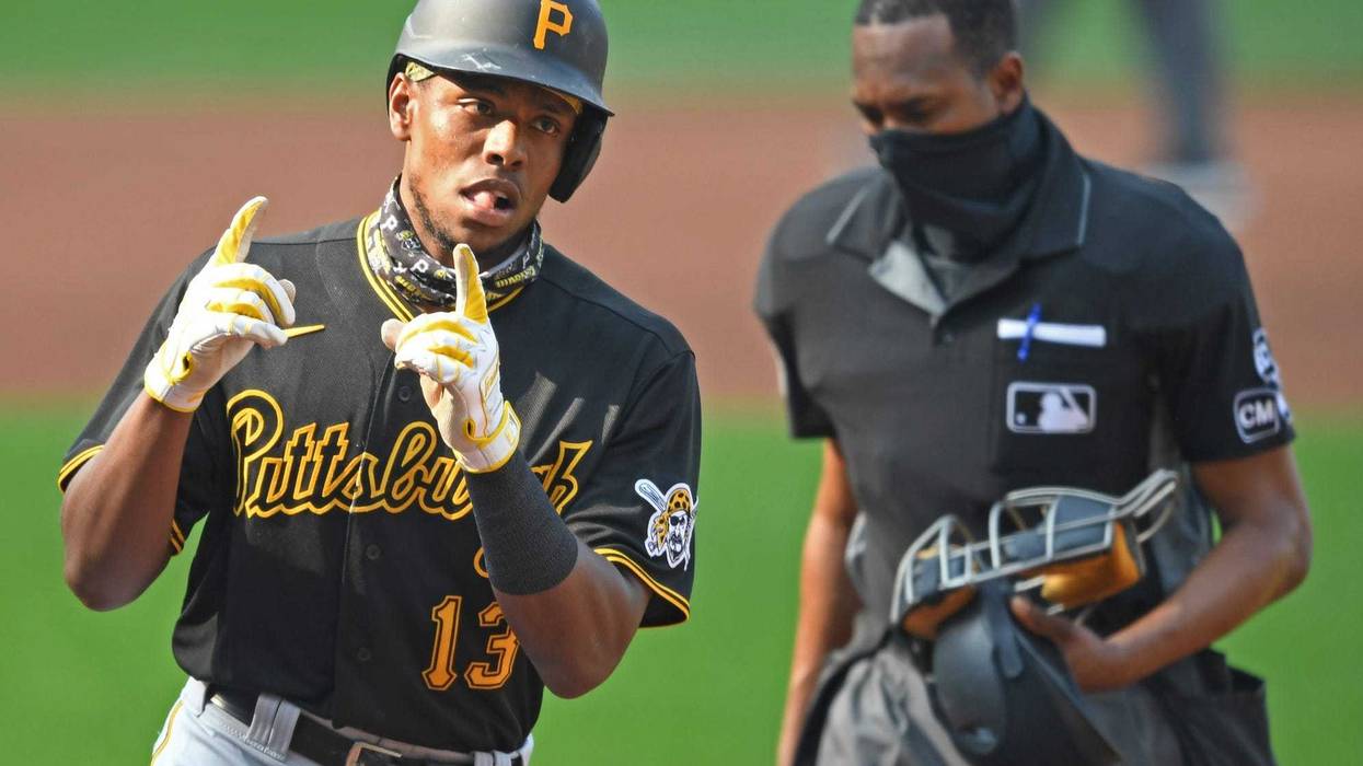Ke'Bryan Hayes rounding the bases with 2 fingers up