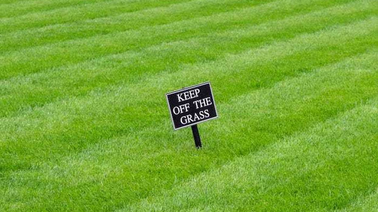 "Keep off the grass" sign on lawn