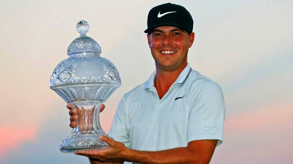 Keith Mitchell holds up his trophy after winning the Honda Classic golf tournament Sunday, March 3, 2019, in Palm Beach Gardens, Fla.