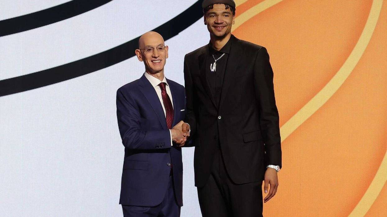 Kel'el Ware poses for photos with NBA commissioner Adam Silver after being selected in the first round by the Miami Heat in the 2024 NBA Draft at Barclays Center.