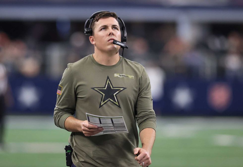 Kellen Moore looks up during a Cowboys game.