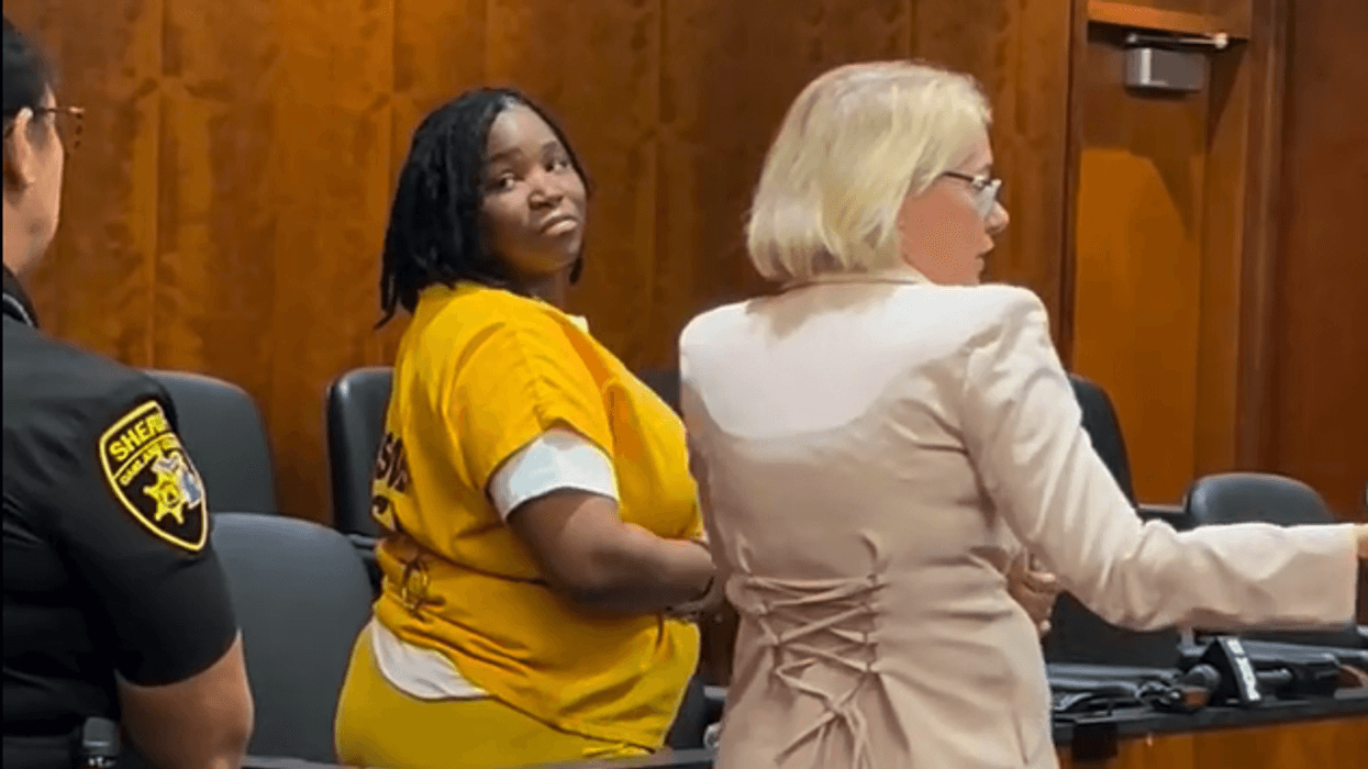 Kelli Bryant, in jail clothes at right, appears in court for sentencing.