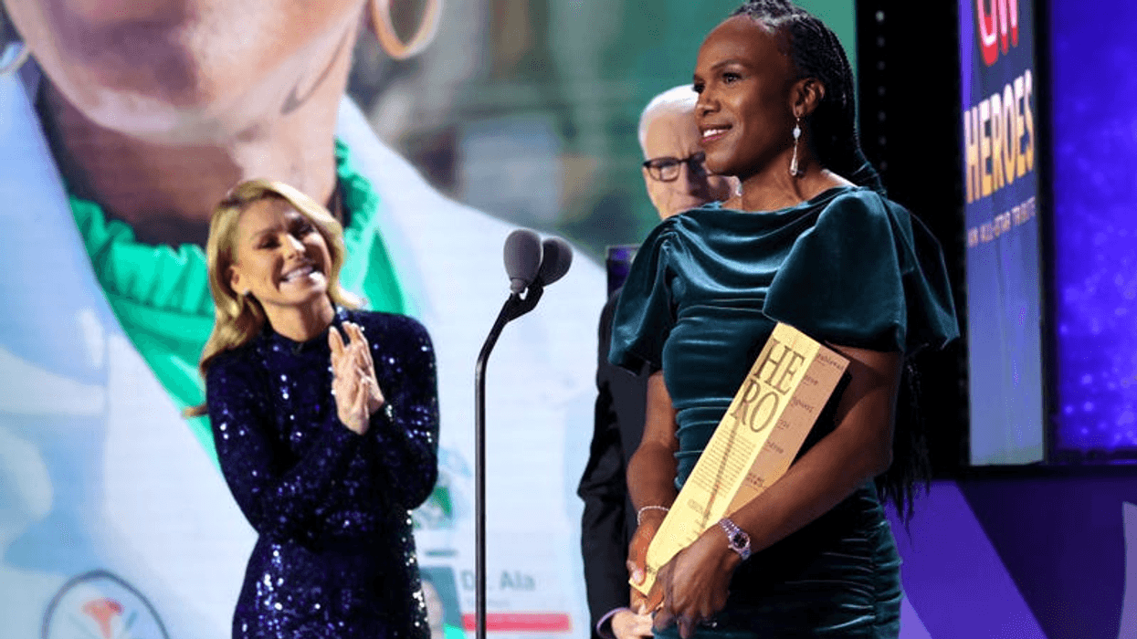 Kelly Ripa, Anderson Cooper and 2021 CNN Hero Dr. Ala Stanford speak onstage during the 15th annual CNN Heroes: All-Star Tribute at the American Museum of Natural History on Dec. 12, 2021, in New York City.
