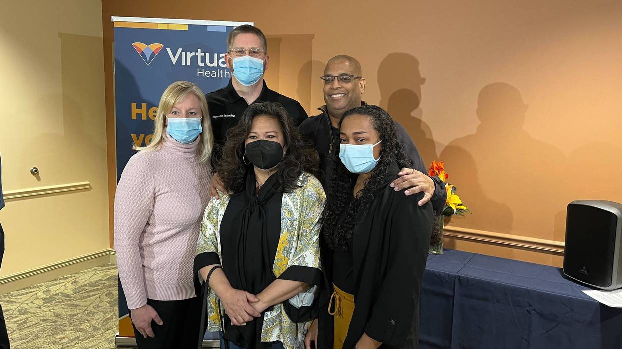 Ken Hogan posing with people who saved his life