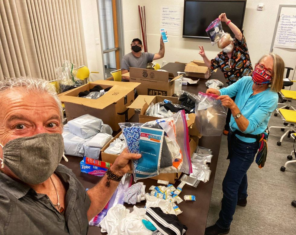 Ken Newman and his team pack essential items into baggies.