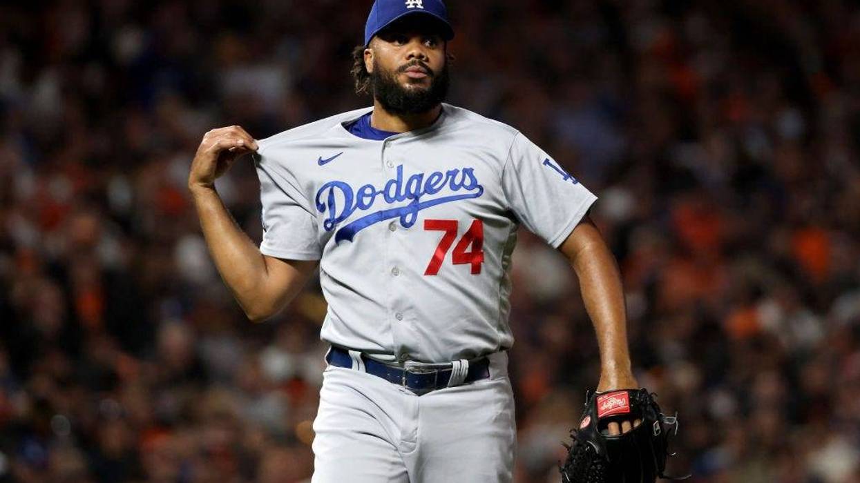 Kenley Jansen #74 of the Los Angeles Dodgers reacts against the San Francisco Giants during the eighth inning in game 5 of the National League Division Series.